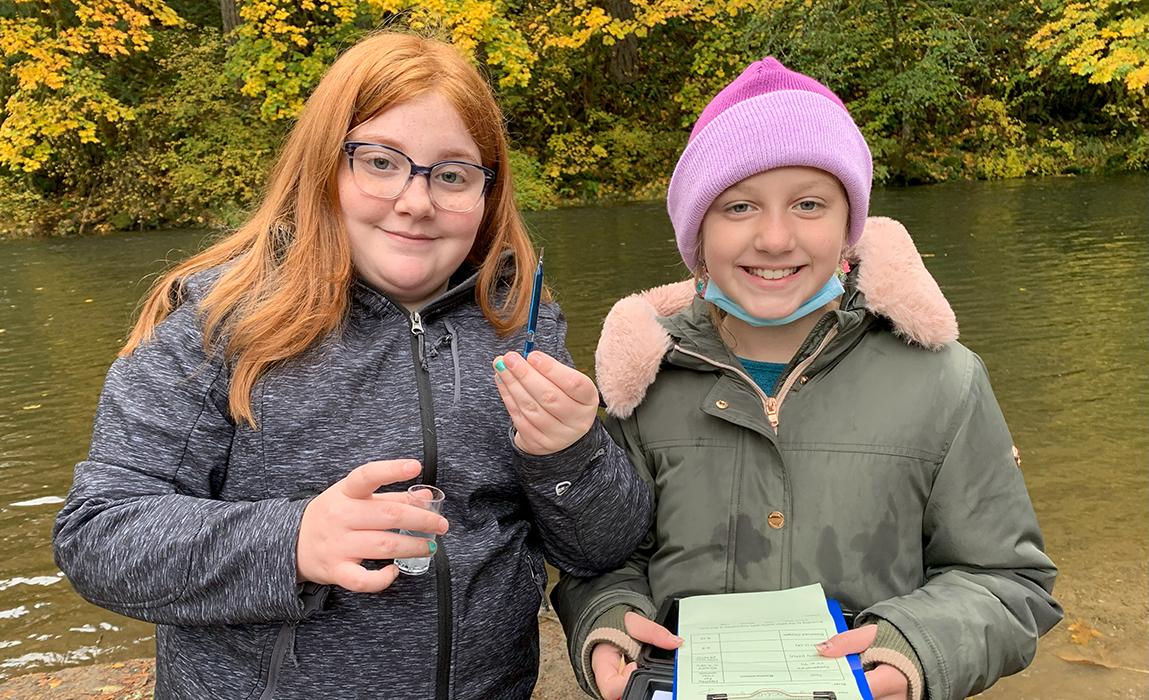 two students testing water quality