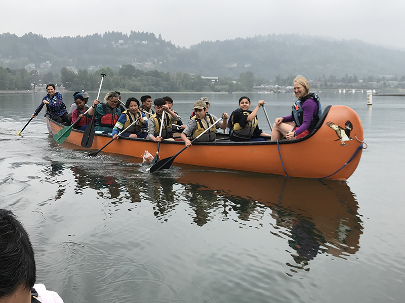 refugees paddle a Big Canoe