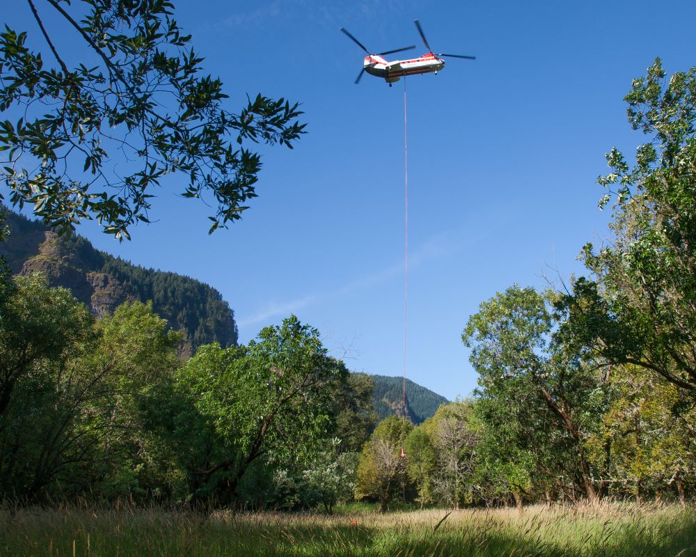 helicopter flies in large log