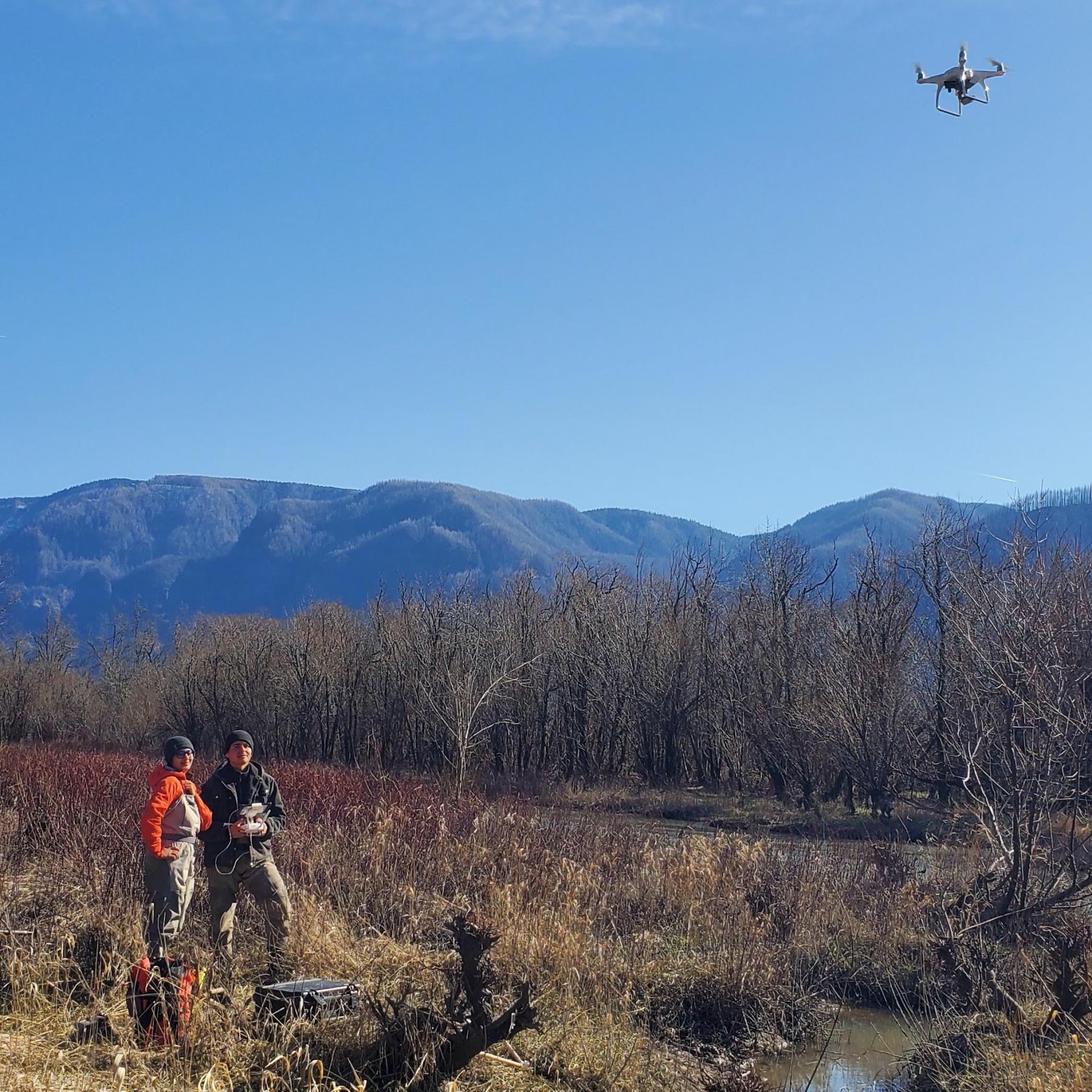 Sneha and Narayan fly a drone at Franz Lake