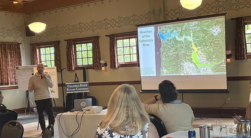 Derek Marquis presents with a map of the Columbia River