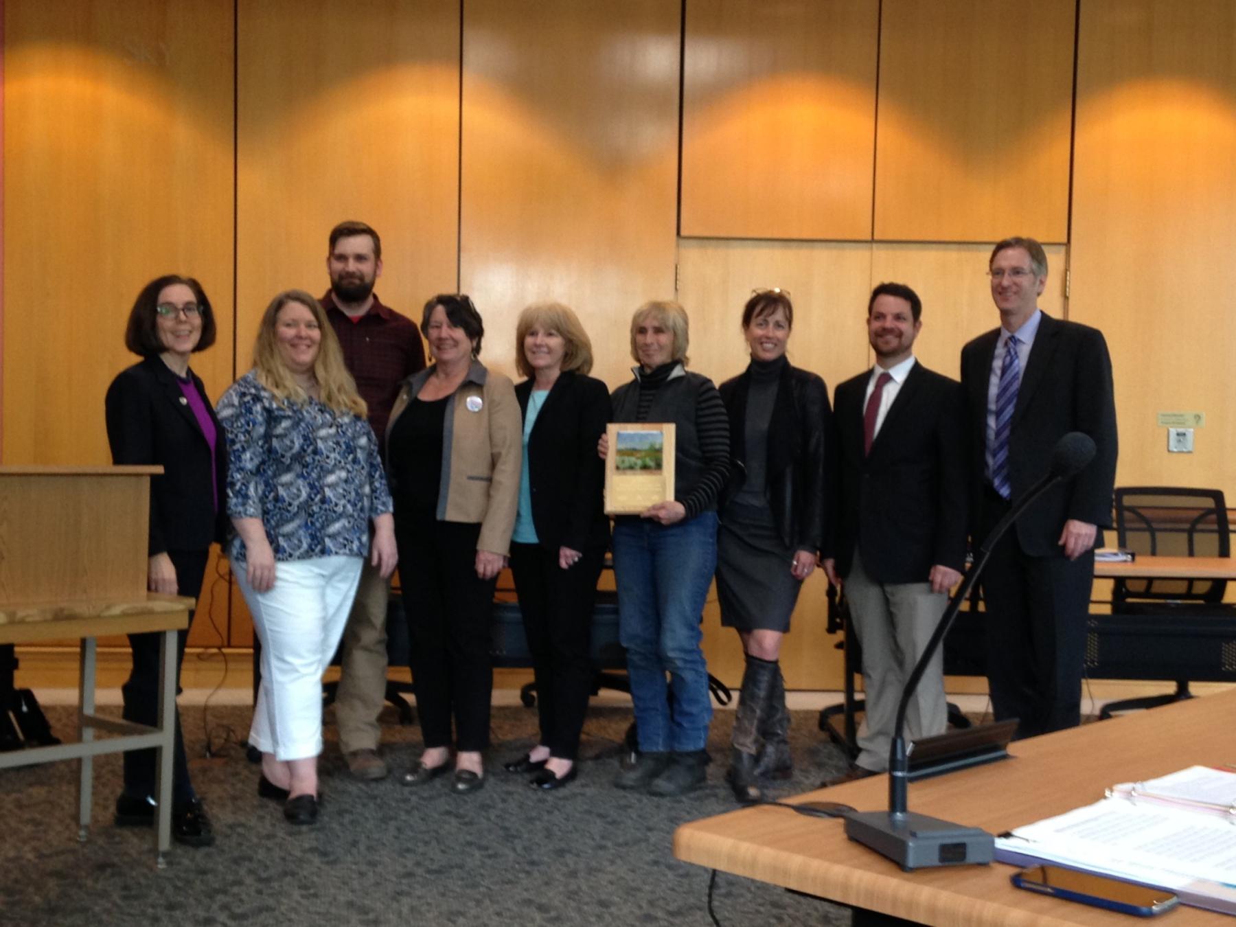 Estuary Partnership staff and board, the Batwater Station Landowner, and members of the land use board stand with the award