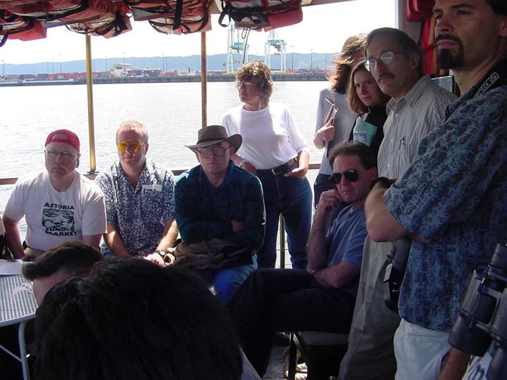 a group of people on a covered pontoon boat