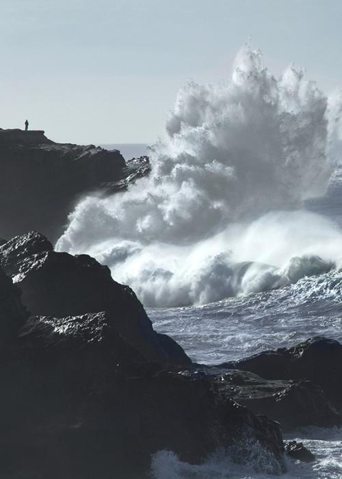 a King Tide crashes up on the cliffs with a huge splash. 