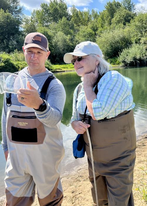 Rep. Abbarno and Councilor Marshall look at lamprey