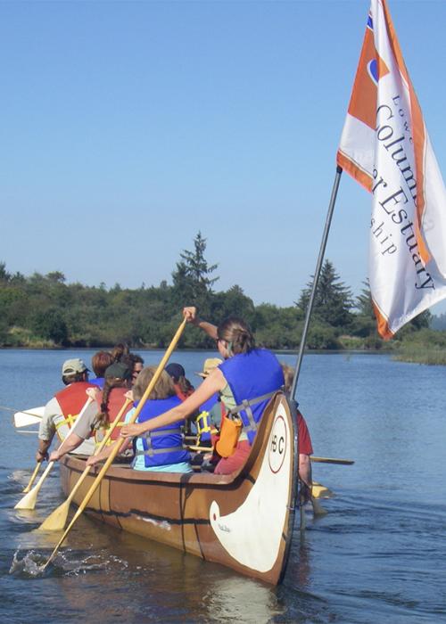 Big Canoe paddling away from the camera