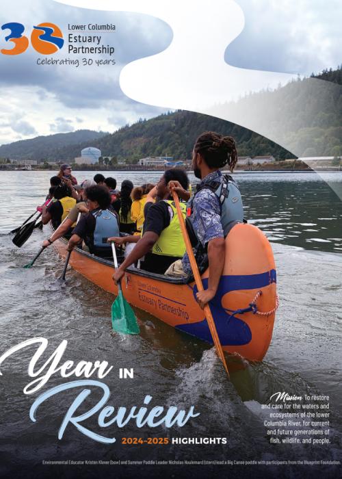 cover page shows a big canoe of people paddling away from the camera